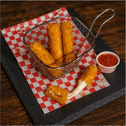 Golden mozzarella sticks in a fry basket with marinara sauce
